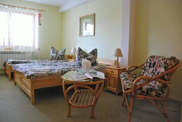 Фото номера Четырехместный номер Отели типа «постель и завтрак» Apartamenty Matuska г. Поронин 2